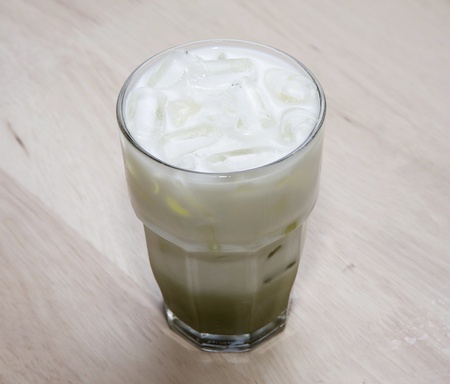 green tea and milk on wood backgroundsの写真素材