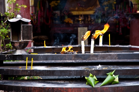 candle in thai templeの写真素材