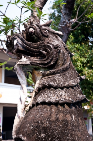 old lion statue in thai templeの写真素材