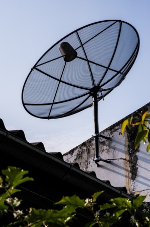 satellite dish on roof houseの写真素材