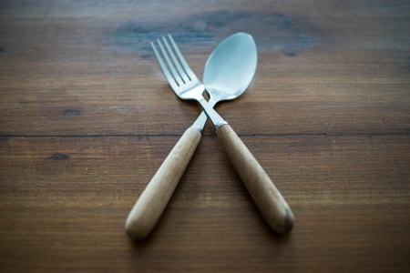 spoon and fork on wood backgrounds