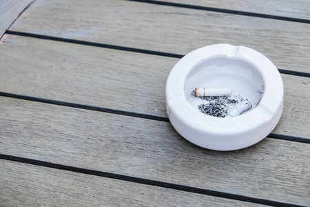 Ashtray on wood backgroundsの写真素材