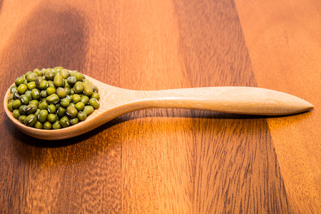 Mug beans in wood spoonsの写真素材