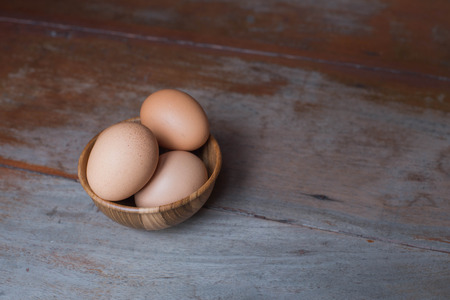 Egg in wood bowl