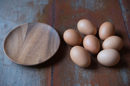 Eggs and wooden plate