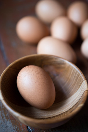 Eggs in wooden bowl