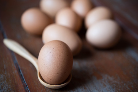 Eggs in wooden spoonsの写真素材