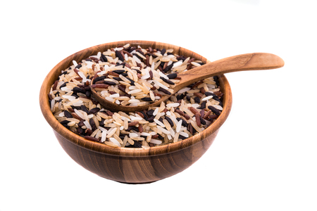 Rice in wooden bowl on white backgroundsの写真素材