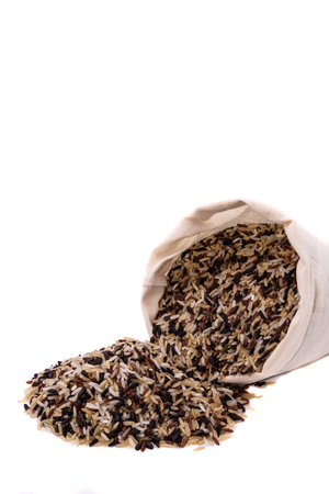 Rice in sack on white backgroundsの写真素材
