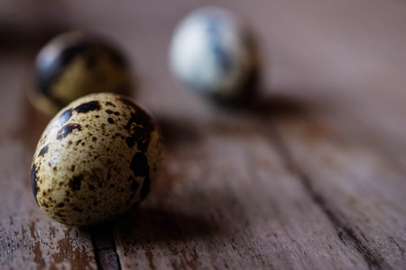 Quail egg in wooden backgroundsの写真素材
