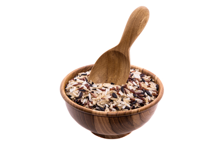 Rice in bowl and wooden spoons on white backgroundsの写真素材
