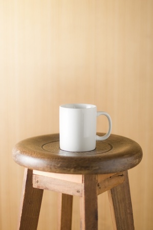 Wooden wall with old chair and cupの写真素材