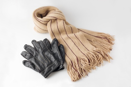 Beige winter wool scarf and leather glovesの写真素材