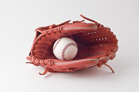 a baseball glove and ball on white background