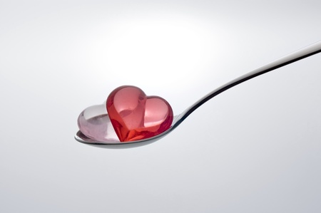 Scoop the Small heart shape sundries with a spoonの写真素材