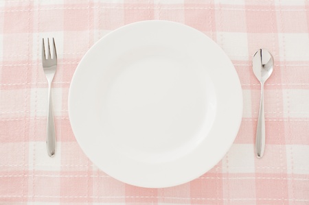 white plate spoon and fork