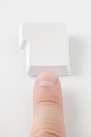 Finger pressing the buttonの写真素材