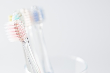 Toothbrush, glass on white background