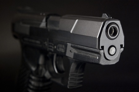 Close Up of pistol on black backgroundの写真素材