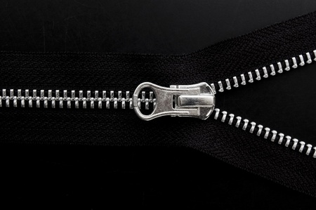 Close up of zipper on black background.の写真素材