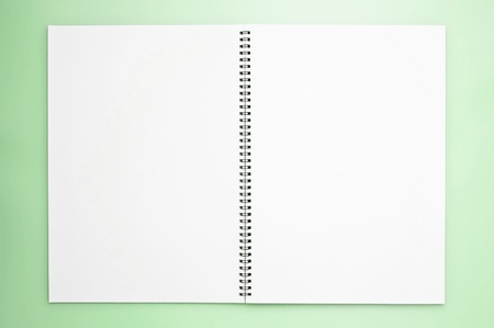 open sketchbook on the green backgroundの写真素材