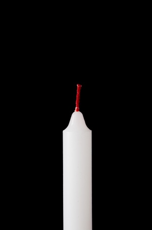 white candle on blackの写真素材