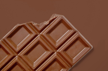 Chocolate bar on brown backgroundの写真素材