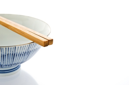 Rice bowl and wooden chopstick on white background 