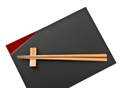 Wooden chopstick on lacquered tray, close up の写真素材