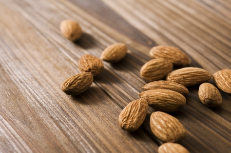 Almonds on wooden backgroundの写真素材