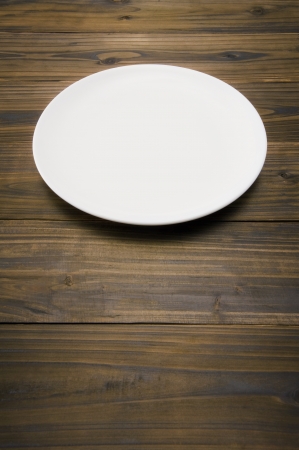Empty dish on wood tableの写真素材