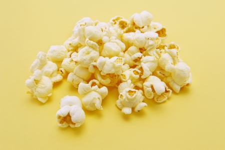 Popcorn on yellow backgroundの写真素材