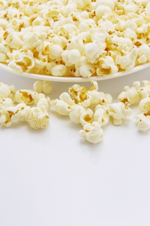 Popcorn on a white plateの写真素材