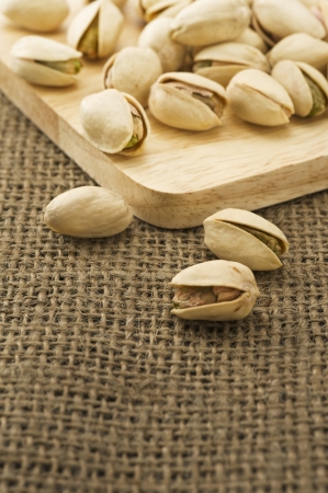 Pistachio on woodenの写真素材