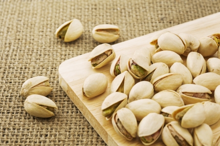 Pistachio on woodenの写真素材