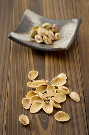 Pistachio on woodenの写真素材
