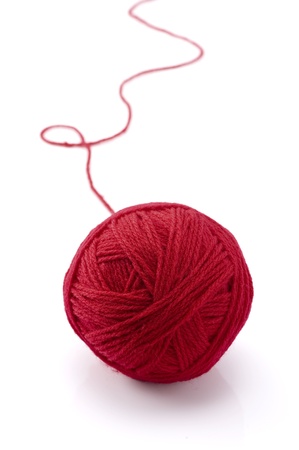 Ball of red yarn on white backgroundの写真素材