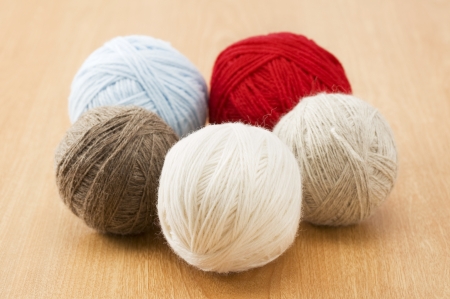 Ball of yarn on wood tableの写真素材