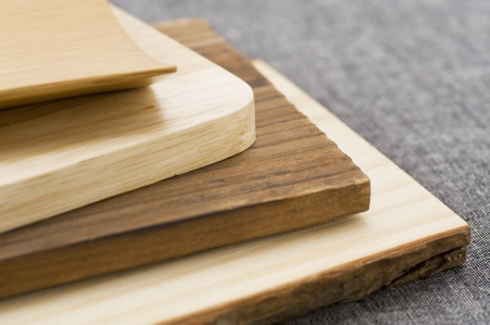 Stacked wooden board various kinds, close-up shoot の写真素材