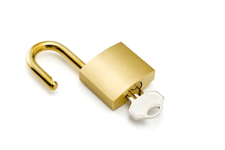 Close-up of padlock and key on white background 
