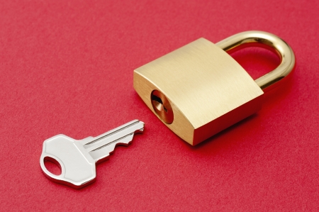 Padlock on red background の写真素材