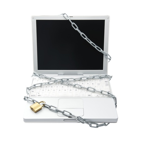 PC protected by key and chain の写真素材