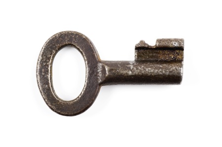 Old rusty iron key isolated on white background の写真素材