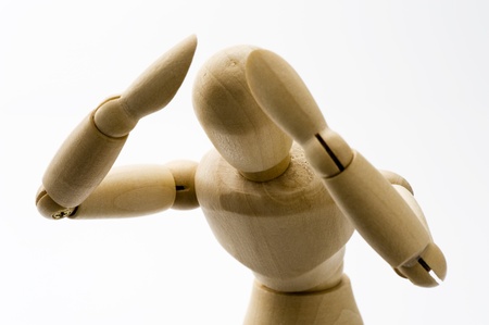 Wooden puppet suffer distress, at a loss の写真素材