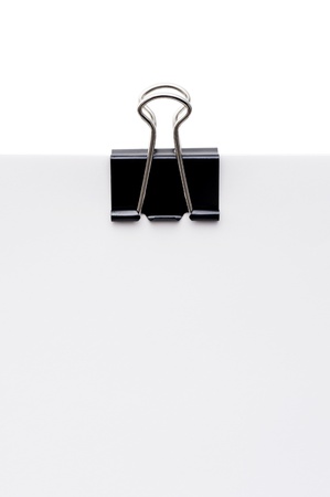 Black clip and blank paper on white background の写真素材