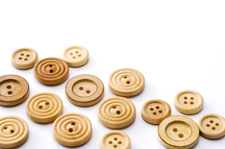 Wooden sewing buttons on white backgroundの写真素材