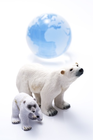 Polar bear family dolls and blue glass globe の写真素材