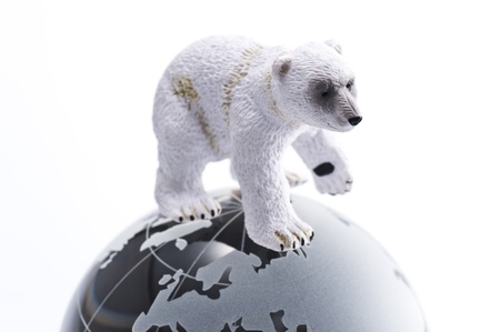 Polar bear baby doll on clear glass globe の写真素材
