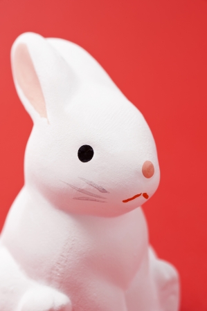 rabbit, japanese new year image on red background の写真素材