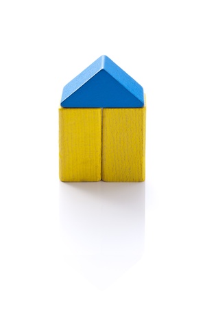 Wooden house made   8203;  8203;of colorful building blocks の写真素材